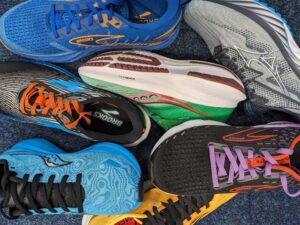 Getting the right running shoe fit - image of a pile of running shoes